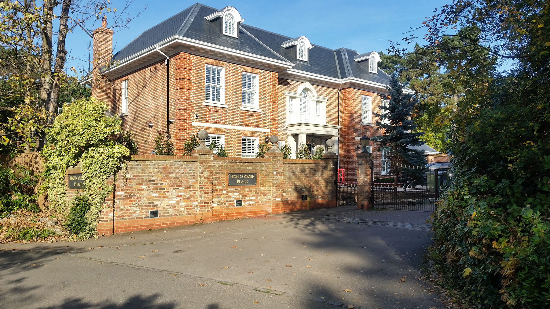 Driveway and brick boundary wall at a large private house, High Coombe Place, Kingston upon Thames